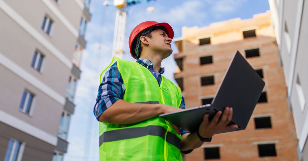Construction person struggling with their ads ion laptop