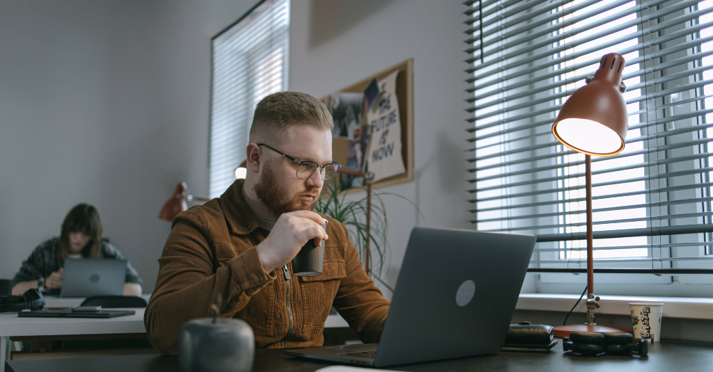 A person checking on a laptop for HubSpot’s SEO Tools