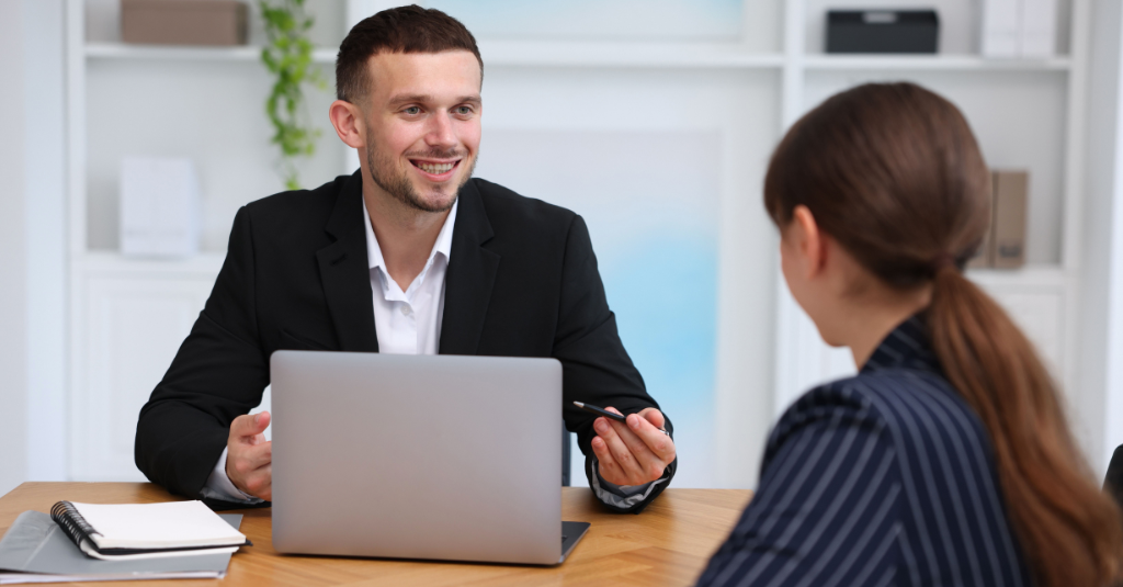 A HubSpot Solutions Partner talking to a client